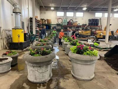 Volunteers in Grafton Come Together to Assemble Flower Planters